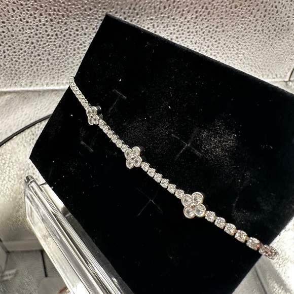 This bracelet is silver over brass with beautiful CZs and is adjustable. - Picture 5 of 8